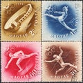 Four postage stamps printed in Hungary with the image of the stadium, gymnast, runner and fencer from the series XV Olympic Games