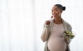 Hungry african american pregnant woman enjoying fresh vegetable salad Royalty Free Stock Photo