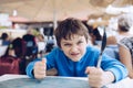 Hungry angry little boy waiting for his dinner Royalty Free Stock Photo