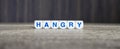 Hangry boggle word cubes on dark background