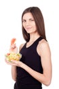 Hungry beautiful healthy woman holding salad on white background