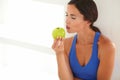 Hungry beautiful woman kissing an apple