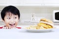 Hungry boy looking at beef burger Royalty Free Stock Photo