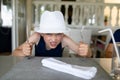 Hungry boy waiting for dinner in restaurant. Royalty Free Stock Photo