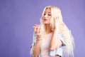 Photo of female holds sweet delicious doughnut