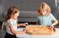 Hungry children eating pizza. Kids preparing to eat fresh pizza.