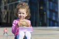 Hungry cute child with appetite eating fast food, portrait. happy girl biting homemade sandwich. harmful, unhealthy, healthy meal.