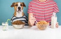 Hungry dog and human having breakfast together. Minimalistic ill Royalty Free Stock Photo