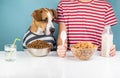 Hungry dog and human having breakfast together. Minimalistic ill Royalty Free Stock Photo