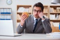 The hungry funny businessman eating junk food sandwich Royalty Free Stock Photo