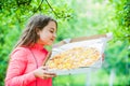 Hungry girl pizza box nature background, food delivery concept Royalty Free Stock Photo