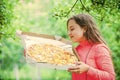 Hungry girl pizza box nature background, food delivery concept Royalty Free Stock Photo