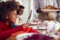 Hungry Girl Waiting For Food As Multi Generation Family Sit Down To Eat Christmas Meal At Home Royalty Free Stock Photo