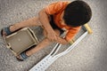 Hungry kid begging with a crutches beside Royalty Free Stock Photo