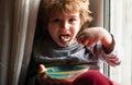 Hungry kid eat. Child eating healthy food. Cute little boy having soup for lunch. Healthy nutrition for kids. Royalty Free Stock Photo