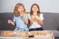 Hungry kids eating pizza. Little girl and boy eat pizza. Royalty Free Stock Photo