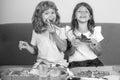 Hungry kids eating pizza. Little girl and boy eat pizza. Royalty Free Stock Photo