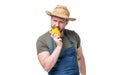 hungry man in apron and hat bite sweet pepper vegetable isolated on white Royalty Free Stock Photo