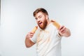 Hungry man in dirty shirt going to eat two hotdogs Royalty Free Stock Photo