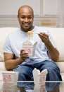 Hungry man eating chinese take-out food Royalty Free Stock Photo