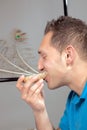 Hungry man eating a wholewheat roll Royalty Free Stock Photo