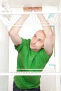 Hungry man in fridge Royalty Free Stock Photo