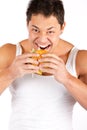 Hungry man with hamburger. over white background Royalty Free Stock Photo