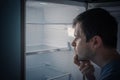 Hungry man is looking for food to eat in empty fridge at night Royalty Free Stock Photo