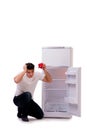 The hungry man looking for money to fill the fridge Royalty Free Stock Photo