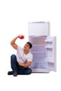 The hungry man looking for money to fill the fridge Royalty Free Stock Photo