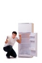 The hungry man looking for money to fill the fridge Royalty Free Stock Photo