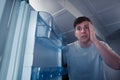 Hungry man looking in refrigerator Royalty Free Stock Photo