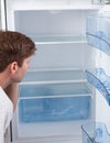 Hungry man looking in refrigerator Royalty Free Stock Photo