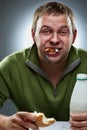 Hungry man with mouth full of bread Royalty Free Stock Photo