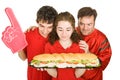 Hungry Partiers with Sandwich Royalty Free Stock Photo