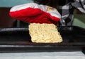 A hungry person about to cook instant noodles on a baking sheet in the oven Royalty Free Stock Photo