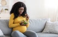 Hungry pregnant woman eating fresh salad for lunch Royalty Free Stock Photo