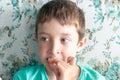 A hungry preteen boy eating greedily chicken nuggets in a restaurant Royalty Free Stock Photo