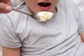 A hungry teen teenager boy eating dumplings close up at home, convenience and rapid cooking food concept