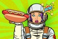 Hungry woman astronaut with hot dog sausage