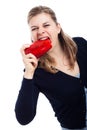 Hungry woman eating paprika Royalty Free Stock Photo