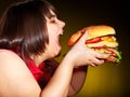 Hungry woman holding hamburger. Royalty Free Stock Photo