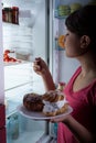 Hungry woman in the kitchen Royalty Free Stock Photo