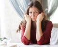 Hungry woman is waiting an order in a restaurant