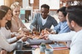 Hungry young employers grabbing slices from delivery pizza