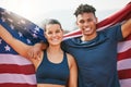 On the hunt for gold. Cropped portrait of two young athletes celebrating their victory while representing their country.