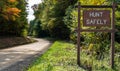 A Hunt Safely sign on the side of the road in the woods in Deerfield Township, Pennsylvania, USA