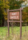 A Hunt Safely sign on the side of the road in the woods in Deerfield Township, Pennsylvania, USA