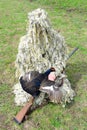 Hunter in camouflage with a gun holds grouse Royalty Free Stock Photo