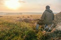 Hunter in camouflage with a gun hunting on grouse in autumn. Royalty Free Stock Photo